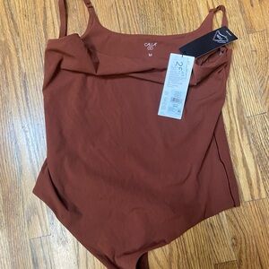 NWT CALIA by Carrie Underwood Rust Bodysuit